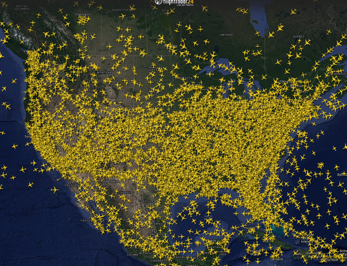Map — flightradar24 snapshot showing thousands of planes over the United States on Sunday, November 26